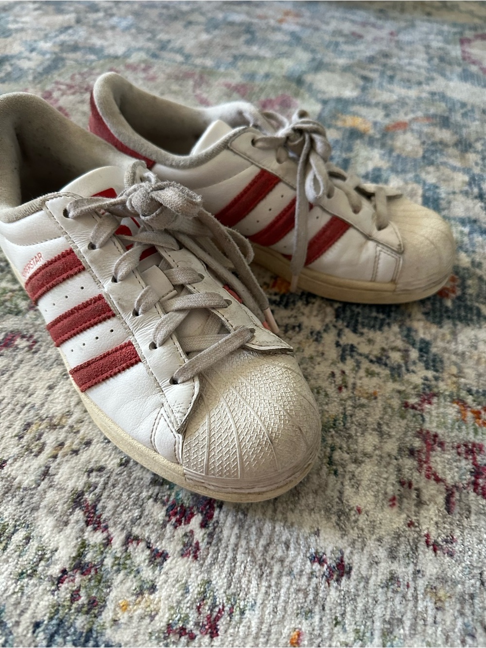 Red and white Adidas Superstars